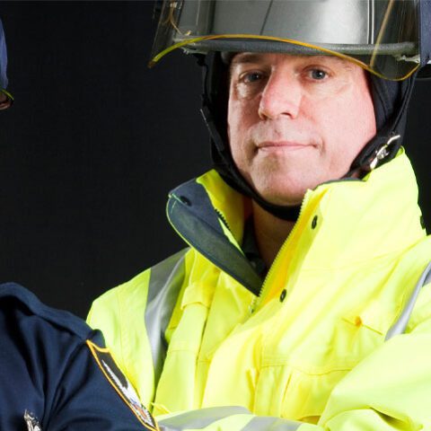 An officer and fire fighter standing together